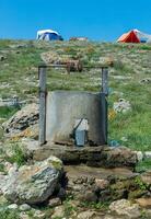 Old well with fresh water at Cape Priboyny in the Dzhangul region in the western Crimea, Tarkhankut photo