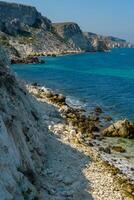View of the steep banks and rocks in the water in the Dzhangul tract, western Crimea photo