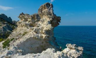 View of the steep banks and rocks in the water in the Dzhangul tract, western Crimea photo