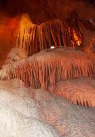 Calcite inlets, stalactites and stalagmites in large underground halls in Carlsbad Caverns NP, New Mexico photo