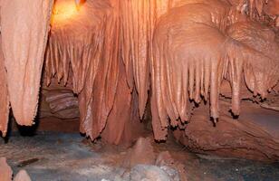 Calcite inlets, stalactites and stalagmites in large underground halls in Carlsbad Caverns NP, New Mexico photo