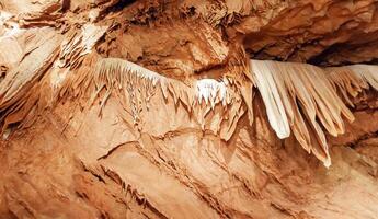Calcite inlets, stalactites and stalagmites in large underground halls in Carlsbad Caverns NP, New Mexico photo