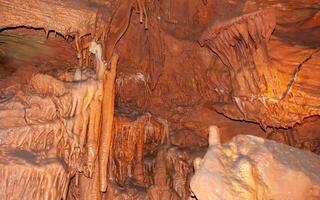 Calcite inlets, stalactites and stalagmites in large underground halls in Carlsbad Caverns NP, New Mexico photo
