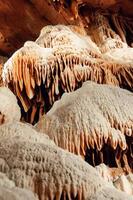 Calcite inlets, stalactites and stalagmites in large underground halls in Carlsbad Caverns NP, New Mexico photo