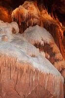 Calcite inlets, stalactites and stalagmites in large underground halls in Carlsbad Caverns NP, New Mexico photo