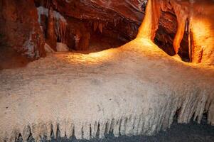 Calcite inlets, stalactites and stalagmites in large underground halls in Carlsbad Caverns NP, New Mexico photo