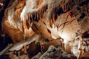 Calcite inlets, stalactites and stalagmites in large underground halls in Carlsbad Caverns NP, New Mexico photo