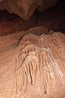 Calcite inlets, stalactites and stalagmites in large underground halls in Carlsbad Caverns NP, New Mexico photo