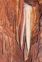 Calcite inlets, stalactites and stalagmites in large underground halls in Carlsbad Caverns NP, New Mexico photo