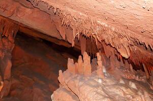 Calcite inlets, stalactites and stalagmites in large underground halls in Carlsbad Caverns NP, New Mexico photo