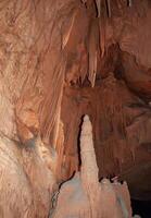 Calcite inlets, stalactites and stalagmites in large underground halls in Carlsbad Caverns NP, New Mexico photo