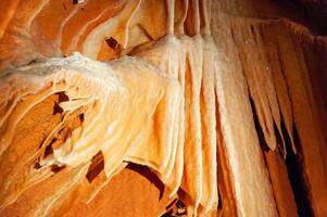 Calcite inlets, stalactites and stalagmites in large underground halls in Carlsbad Caverns NP, New Mexico photo