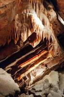 Calcite inlets, stalactites and stalagmites in large underground halls in Carlsbad Caverns NP, New Mexico photo