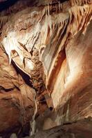Calcite inlets, stalactites and stalagmites in large underground halls in Carlsbad Caverns NP, New Mexico photo