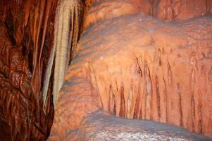 Calcite inlets, stalactites and stalagmites in large underground halls in Carlsbad Caverns NP, New Mexico photo