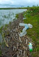 Environmental pollution, plastic garbage on the shore of lake Yalpug, Ukraine photo