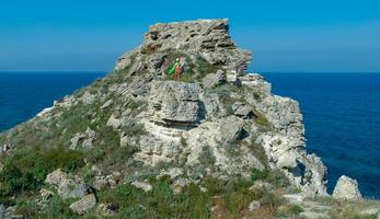 View of the steep banks and rocks in the water in the Dzhangul tract, western Crimea photo