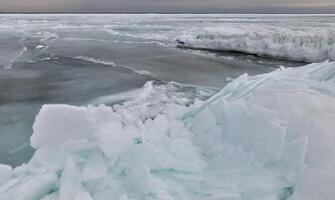 Coastal cliffs and coastal protection structures frozen with ice in the cold winter of 2010, the Black Sea photo