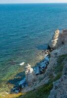 View of the steep banks and rocks in the water in the Dzhangul tract, western Crimea photo