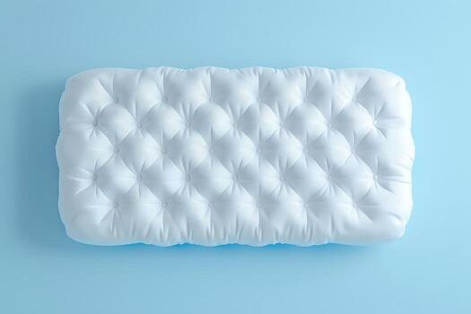 Soft textured white cushion resting on a light blue background, showcasing its inviting design and plush comfort photo