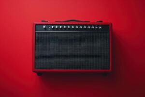 A vibrant red guitar amplifier against a matching backdrop in a minimalist studio setting photo