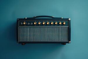 Vintage amplifier resting against a teal wall in a cozy music studio during golden hour photo
