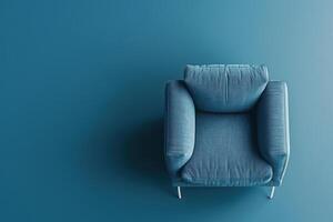 Soft blue armchair resting against a matching wall in a minimalist interior design setting photo