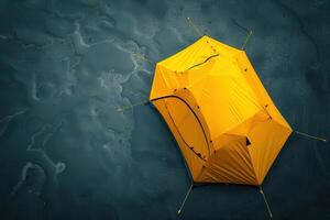 A vibrant yellow tent stands out against the sandy beach at sunrise, inviting adventurers to explore the tranquil seaside photo