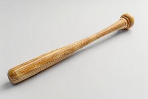 A finely crafted wooden bat resting on a minimalist surface with soft lighting creating an elegant atmosphere photo