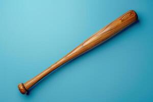 A polished wooden baseball bat resting against a vibrant blue background in a well-lit indoor space photo