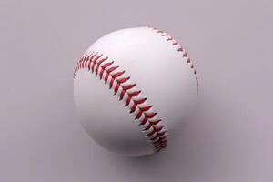 A pristine baseball resting on a soft surface under gentle lighting photo