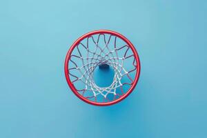 A vibrant basketball hoop against a bright blue backdrop captures the essence of the game, inviting players to take their best shot photo