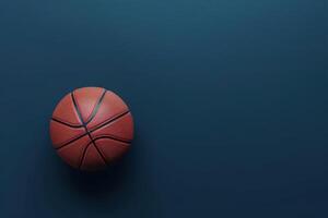A vibrant basketball resting on a sleek blue surface with dramatic lighting illuminated from above photo