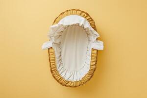 A cozy newborn bassinet resting on a vibrant yellow backdrop, ready for a peaceful slumber in a cheerful nursery photo