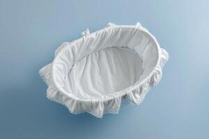 Soft white bassinet resting on a tranquil blue surface, gently inviting a peaceful slumber for a newborn at twilight photo