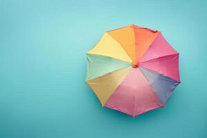 Brightly colored umbrella against a vibrant blue backdrop, capturing a playful summer vibe in a cheerful setting photo