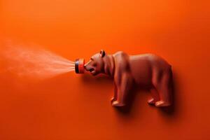 A playful bear figurine sprays mist against a vibrant orange backdrop, capturing whimsy and creativity in a unique indoor setting photo