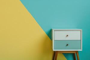 Stylish drawer unit against a vibrant teal and yellow wall in a modern interior design setting photo