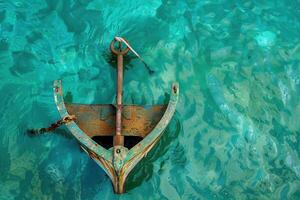 An anchor rests in serene turquoise waters at midday, evoking a sense of tranquility and connection with the sea photo