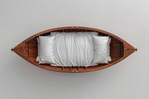 A cozy bed nestled in a wooden boat resting on a minimalist surface photo