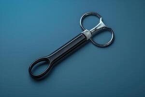 Artistic kitchen scissors resting on a blue backdrop, showcasing a sleek and modern design, perfect for culinary tasks photo