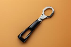 A sleek bottle opener resting on a vibrant orange surface, highlighting its modern design and functional elegance photo