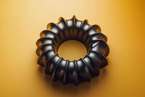A striking black sculptural piece resting on a vibrant yellow background, showcasing intricate curves and modern design photo