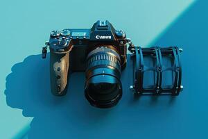 A sleek camera rests on a vibrant blue surface alongside a sturdy lens mount under soft, diffused light in a creative workspace photo