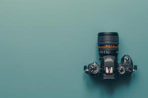 Capturing creativity with a sleek camera on a tranquil teal background, designed for photography enthusiasts and professionals alike photo