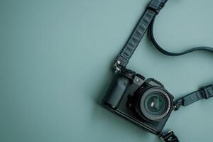 Artistic close-up of a vintage camera lying on a soft turquoise background photo