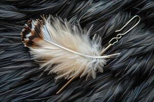 Elegant white feather hairpin resting on a dark feather background photo