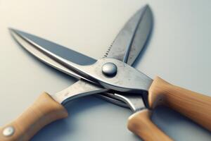 A close-up view of metal scissors with wooden handles resting on a smooth surface in soft light photo