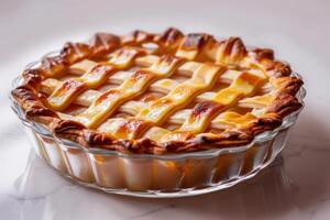 Freshly baked apple pie cooling on a marble countertop in a cozy kitchen photo