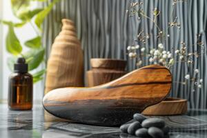 Elegant wooden massage tool surrounded by decorative items and natural elements on a tranquil surface in a wellness setting photo